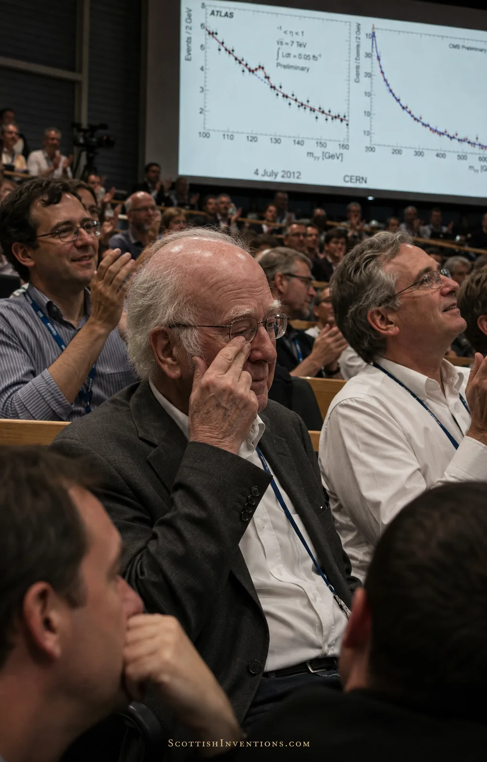 Peter Higgs reacts emotionally in the CERN auditorium during the Higgs boson announcement on 4 July 2012.