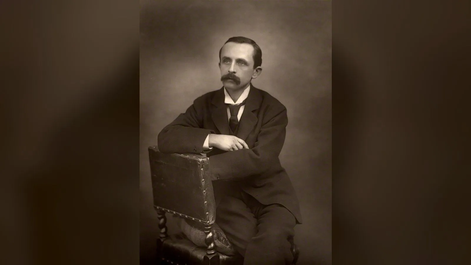 Sepia carbon print of James Matthew Barrie (1860-1937), author of "Peter Pan". Size 9 3/4 in. x 7 1/4 in. (249 mm x 183 mm).
